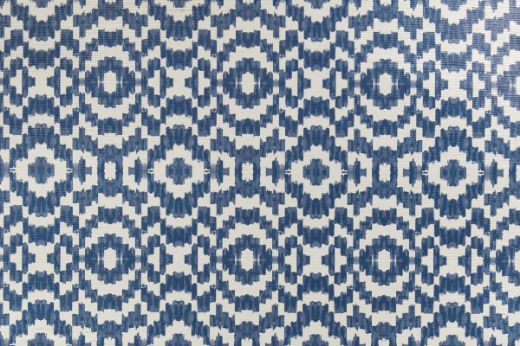 Echo Raffia Wallpaper in Cobalt, showcasing a striking blue geometric design on woven raffia, bringing vibrant energy and texture to spaces.