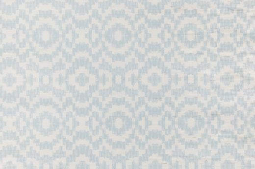 Echo Raffia Wallpaper in Sky, with a soft blue geometric pattern on natural raffia, creating a serene and airy atmosphere in any room.