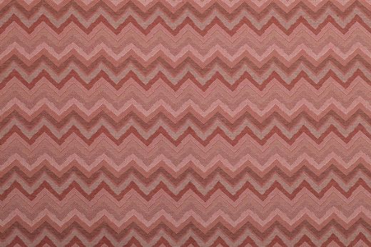 Kazulu Performance Fabric in Rosso—bold zigzag design in tonal reds and soft neutrals, perfect for adding warmth and visual texture to upholstery.