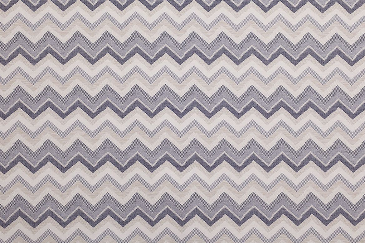 Performance Fabric in Azzurro—features tonal zigzag stripes in layered blue hues, adding a cool, modern edge to indoor and outdoor spaces.