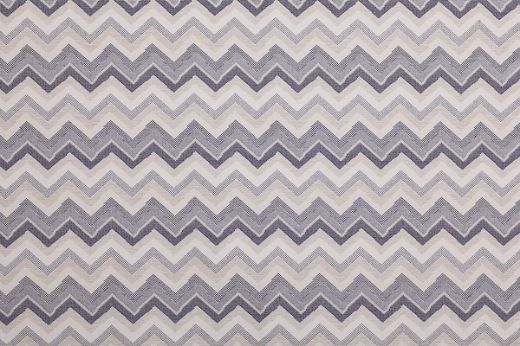 Performance Fabric in Azzurro—features tonal zigzag stripes in layered blue hues, adding a cool, modern edge to indoor and outdoor spaces.