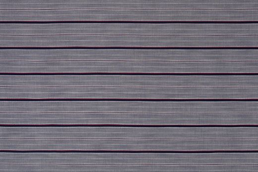 A soft, tranquil horizontal stripe woven fabric in azzurro, showcasing tonal navy blues for a cool, calming effect in both residential and commercial interiors.