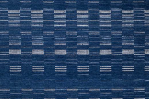 An outdoor, performance woven geometric stripe design in indigo tonal colours with white accents.