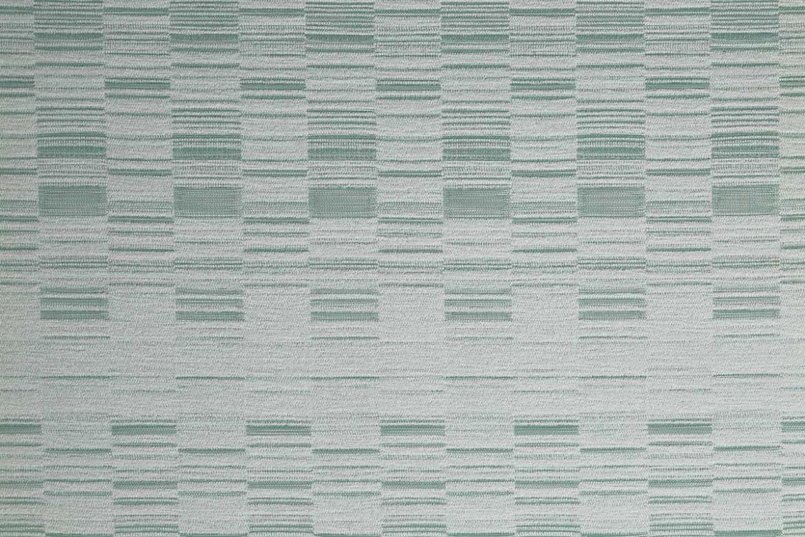 An outdoor, performance woven geometric stripe design in pale green tonal colours.