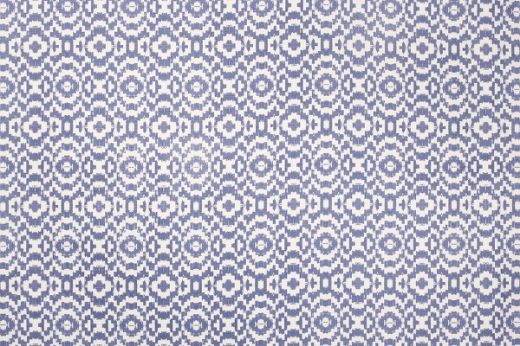 Echo Printed Fabric in Indigo, with bold blue circular forms on a white linen base, creating a dynamic visual effect with rich, modern contrast.
