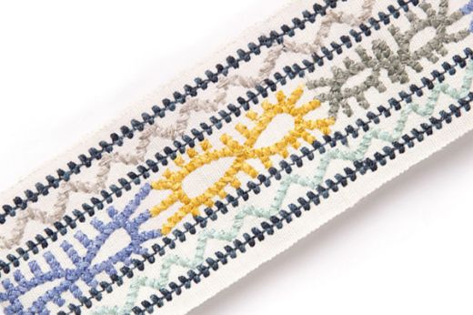 Caravanne Border Trim in Indigo – bold indigo and multicolour Aztec-style embroidery over natural linen base