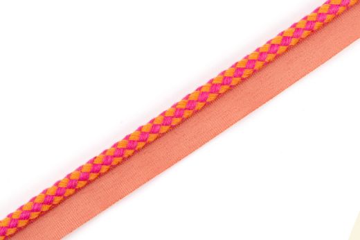 Circus Piping Trim in Hot Pink, with a bold two-tone check in pink and orange, adding a playful and vibrant touch to cushions, drapery, and bespoke interiors.