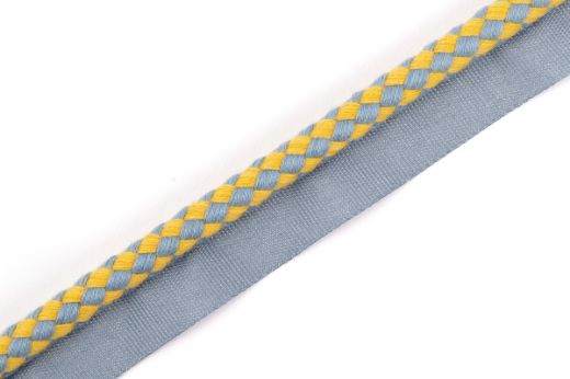 Circus Piping Trim in Old Blue, showcasing a striking blue and yellow check design, ideal for accentuating furniture, curtains, and home accessories with a dynamic pop of colour.