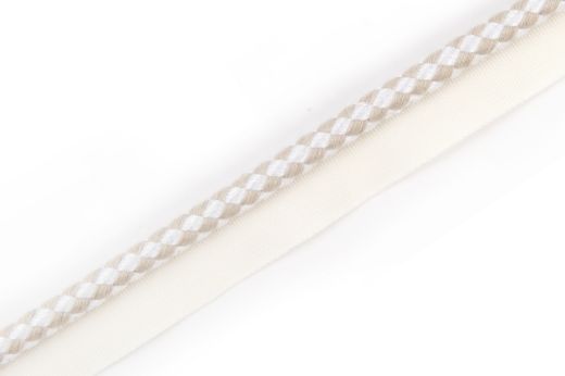 Circus Piping Trim in Natural, with a subtle two-tone check pattern in natural and white, a versatile and timeless trim perfect for enhancing any interior.