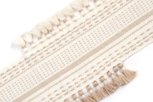 Pom Parade Border Trim in natural — light linen-toned stitched border with tasselled trims in ecru and natural.