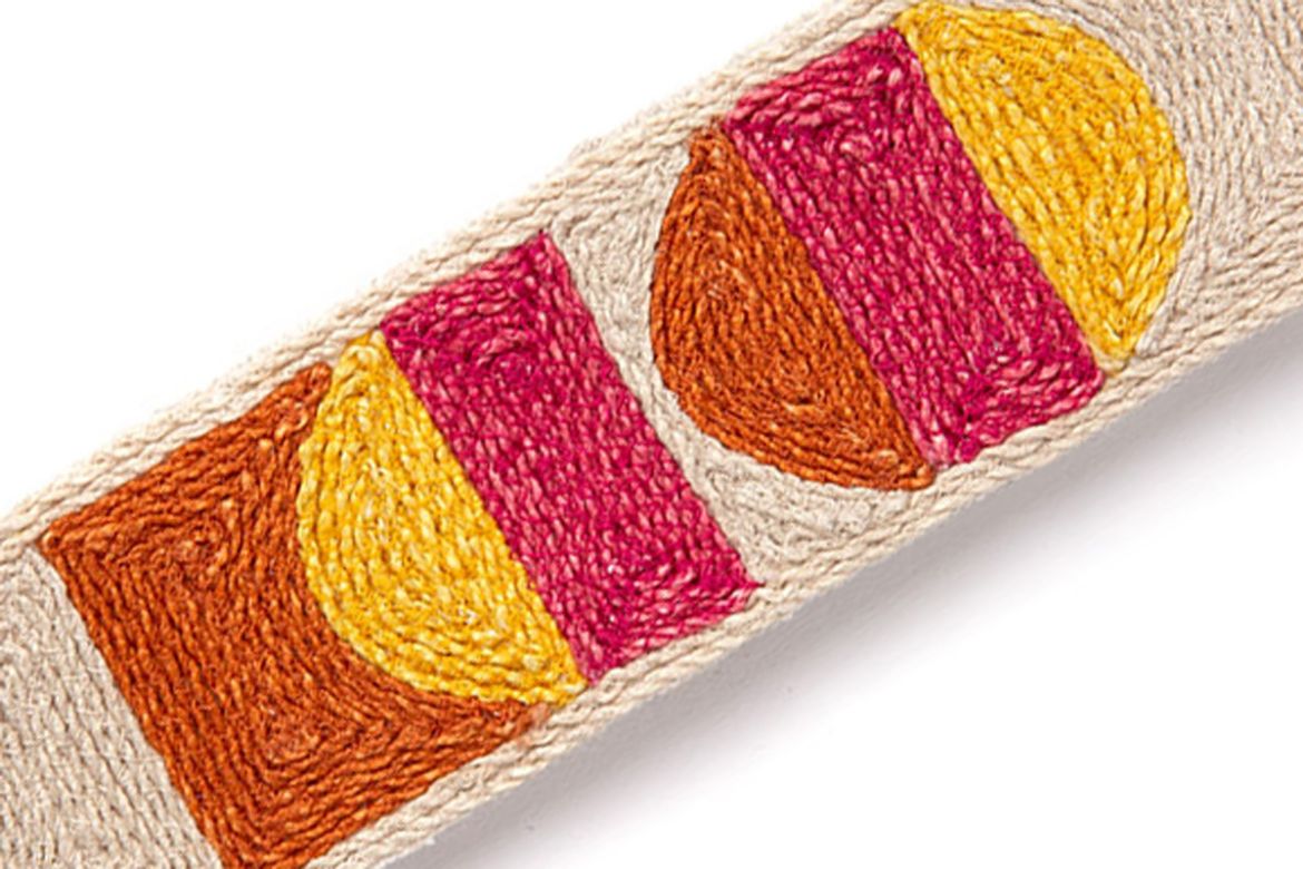 Pop Art Border Trim in Orange – features a playful mix of pinks, oranges, and yellows embroidered on a natural jute base.