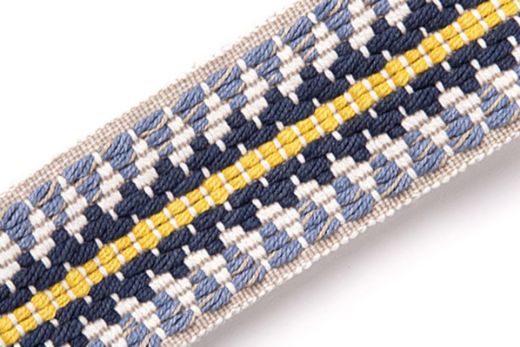 Railroad Border Trim in Indigo – navy, cobalt, and slate blue embroidered stripes create a bold contrast on an ecru background.