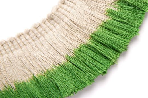 Hand-dyed ombré fringe in a fresh green tone, fading into natural linen for a soft, botanical accent.