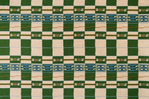 Chubby Check Woven Fabric in Green, showcasing checks in green, blue, natural, and ochre yellow. Perfect for contemporary curtains, cushions, and home accents.