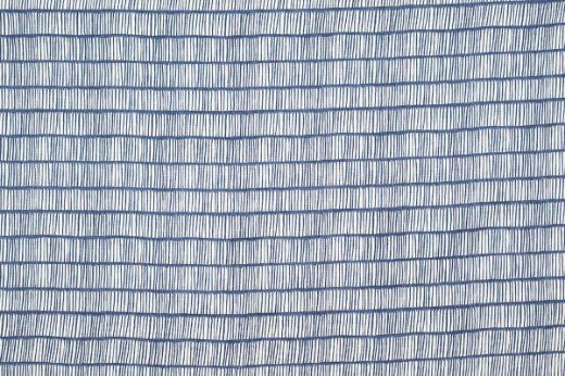 Crochet Printed Linen Fabric in Indigo, showcasing a rich blue tone over white linen with an abstract, linear pattern for modern interiors.