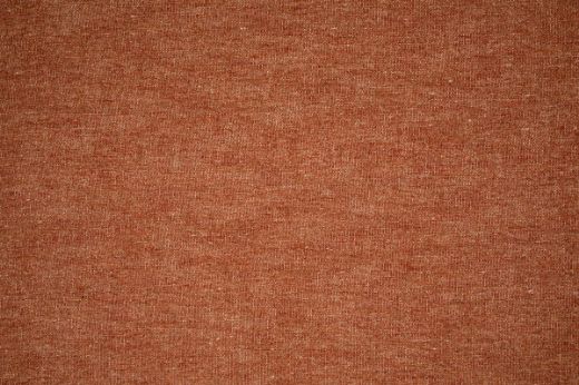 Denali Plain Woven Fabric in Terracotta, with a warm, earthy orange-brown tone and textured weave, ideal for adding rustic charm and depth to interiors.