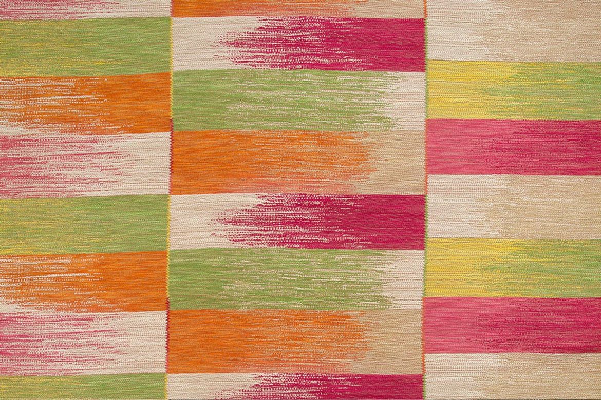 Vibrant Lime Ikat Weave Fabric featuring pinks, orange, and lime green interwoven with natural tones, creating a lively and dynamic design.