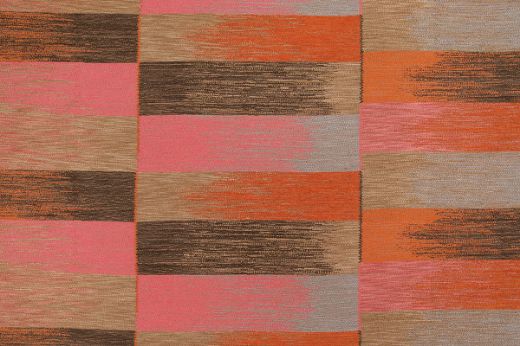 Warm Orange Ikat Weave Fabric, blending rich browns, oranges, and pink hues, offering a bold and earthy aesthetic with a touch of playful contrast.