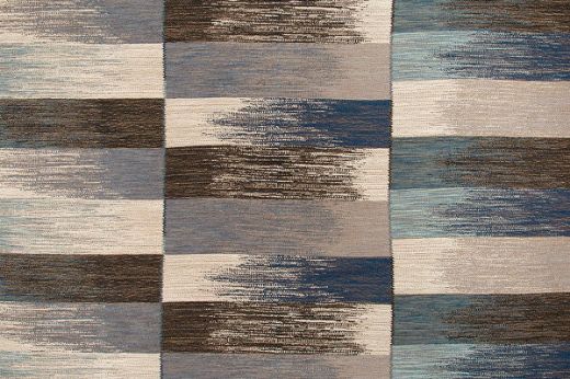 Deep Indigo Ikat Weave Fabric with a mixture of tonal blues, offering a sophisticated and calming design with subtle depth and texture.