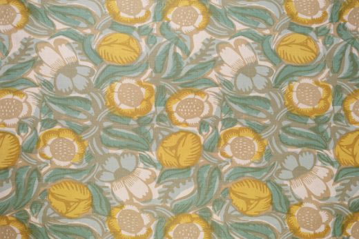 La Forêt Printed Fabric in Lemon—features a painterly floral design in vibrant yellow and aqua green, evoking a fresh, sunlit aesthetic.