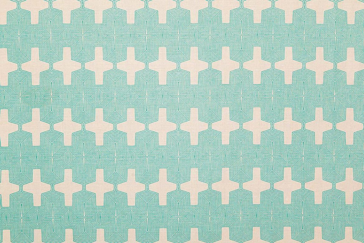 Laguna Printed Fabric in Turquoise – bold Aztec-inspired geometric pattern printed in vibrant turquoise on natural white linen.
