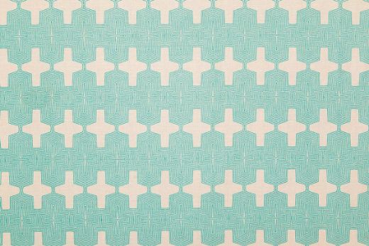 Laguna Printed Fabric in Turquoise – bold Aztec-inspired geometric pattern printed in vibrant turquoise on natural white linen.