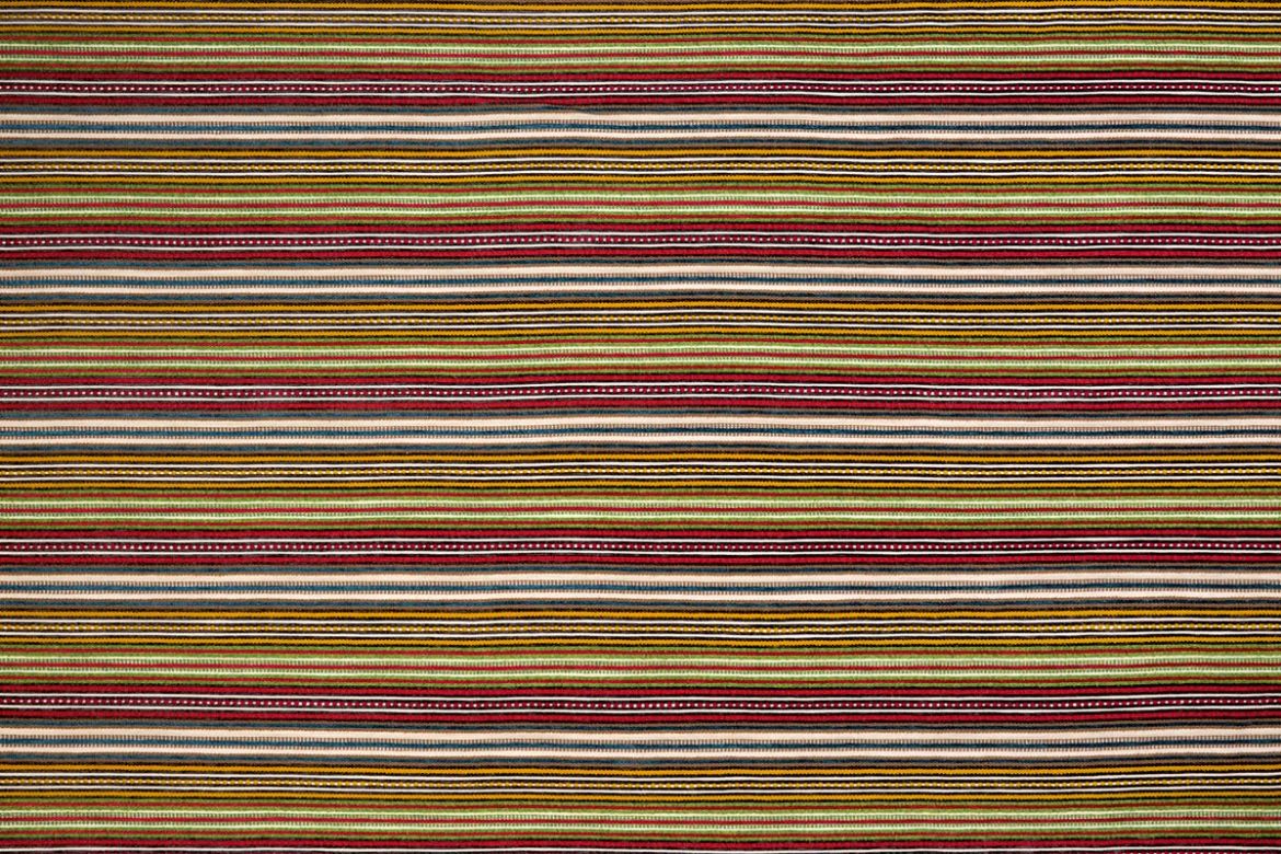 A multicoloured woven stripe design with dominant lime green tones, featuring rich textural variation and vibrant accents within a fresh, earthy palette.