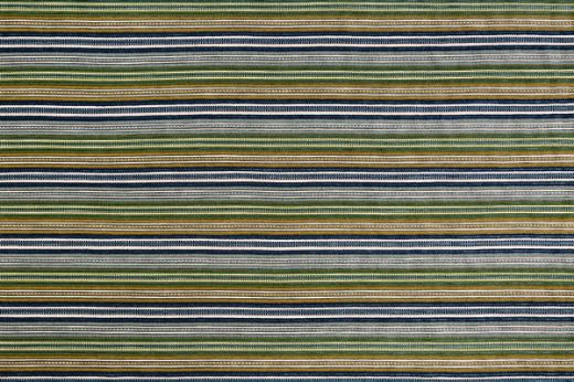 A tonal striped fabric showcasing deep indigo as the lead colour, woven with an array of nuanced shades for a bold yet sophisticated effect.