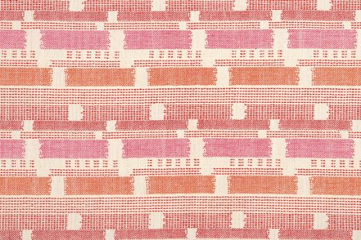 Loom Weave woven fabric in Hot Pink, featuring a bold mix of orange, pink, and natural tones. A richly textured textile with vibrant artisan flair.
