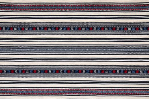 Romany Printed Weave in Indigo – rich navy and ivory stripes evoke a sense of bold elegance, offering a timeless contrast for sophisticated interiors.