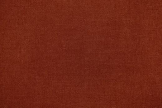 Pebble Woven Fabric in paprika, a rich burnt orange shade with tactile depth and artisanal woven detail.