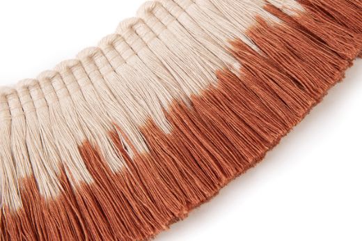 Linen fringe trim dip-dyed in warm terracotta tones with a natural base, creating an earthy ombré detail.