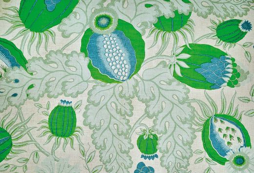 Christopher Farr Cloth Carnival Indoor Print Green. A detailed botanical illustration featuring large stylised flowers in shades of green, beige and blue, with intricate leaves and stems on a light background. 