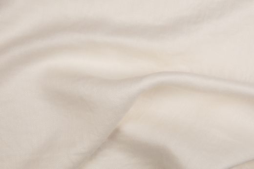 White Beaumont fabric draped to highlight natural texture.