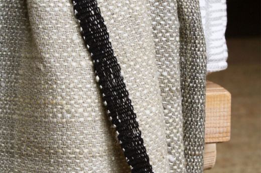 Textured woven striped natural throw black edging christopher farr cloth