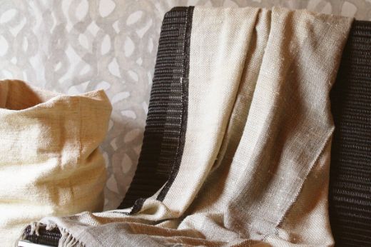 Textured woven striped natural throw black edging christopher farr cloth