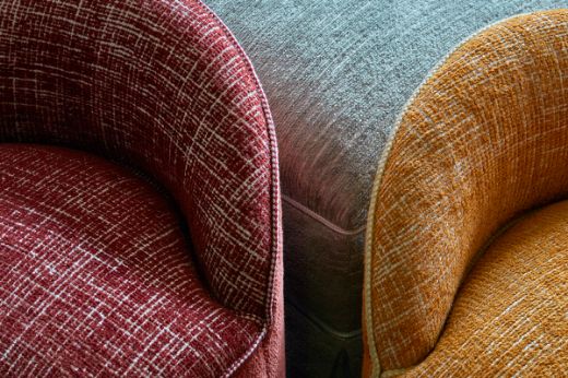 Luxury Collection Weaves upholstered chairs in Christopher Farr Cloth showroom 