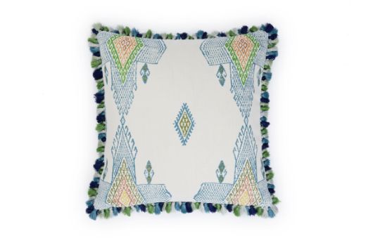 Front view of Travelling Light Teal cushion featuring vibrant teal, green, and blue geometric and triangle patterns with yellow and orange accents, finished with green Jamboree fringe trim.