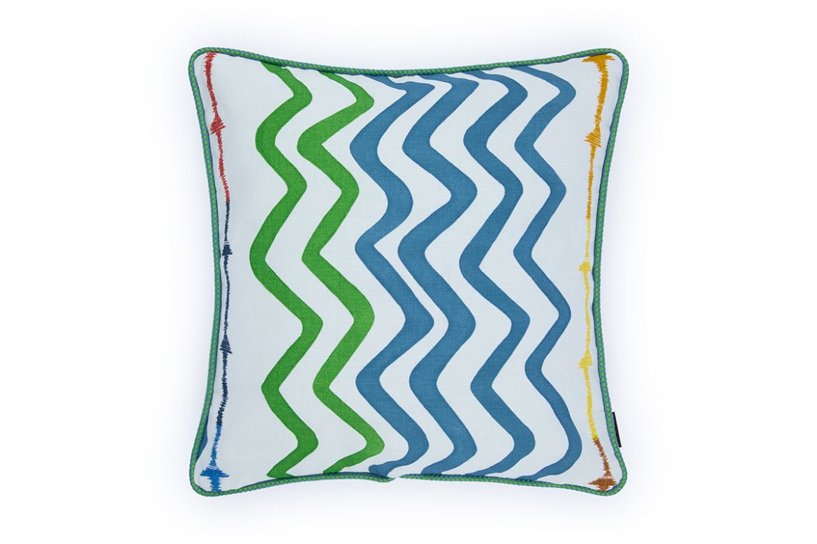 Front view of Rick Rack cushion in green, featuring Kit Kemp’s fluid embroidered arrow design and finished with vibrant Circus piping for a bold, artisanal look.